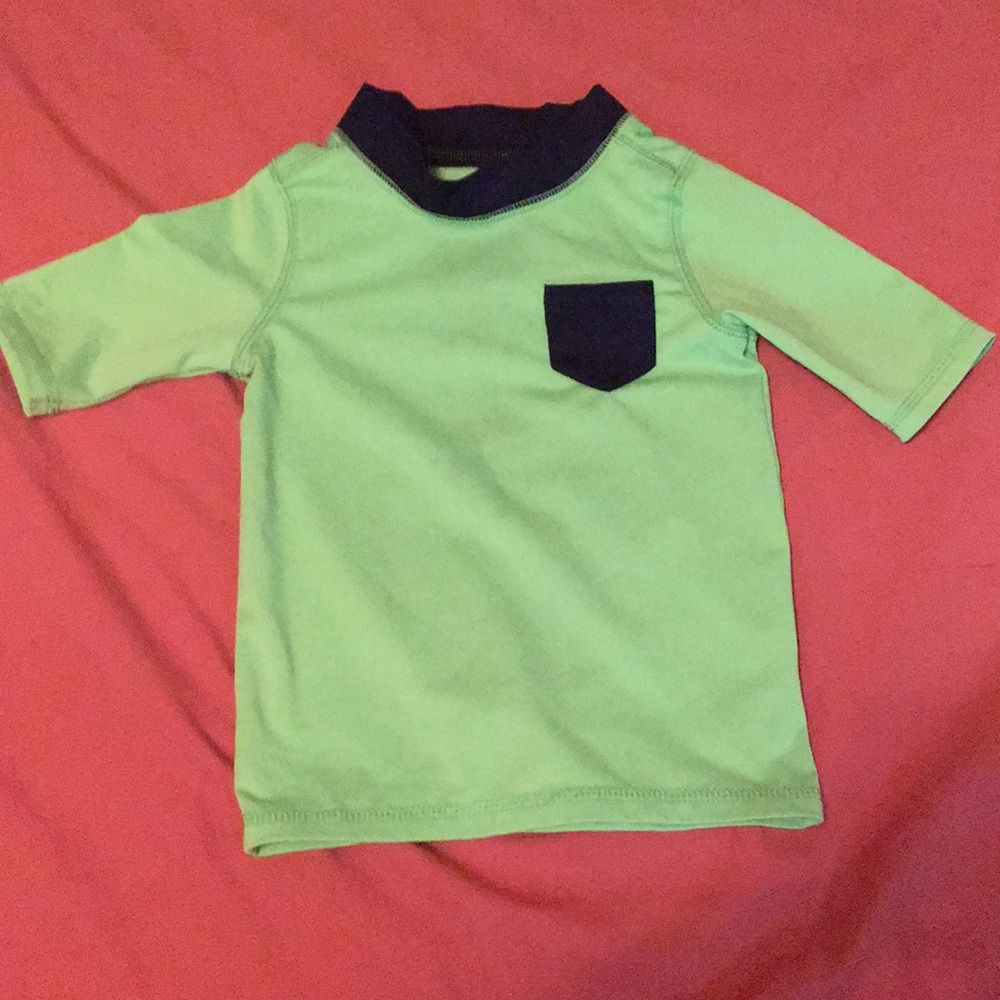 A neon green swimsuit boys top